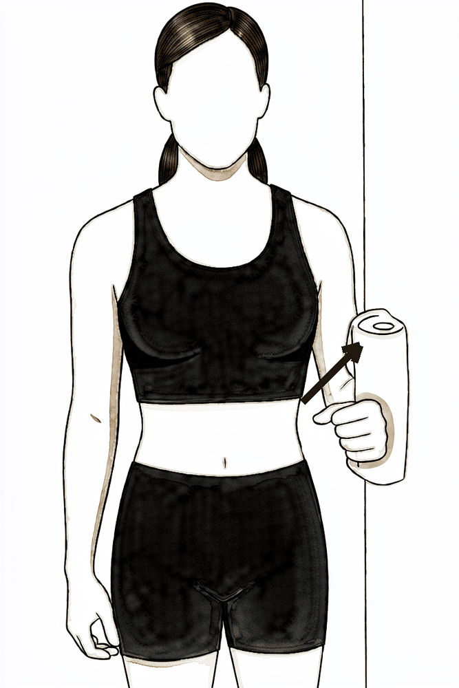Standing with the elbow at the side, pressing the outer arm into a wall without moving.